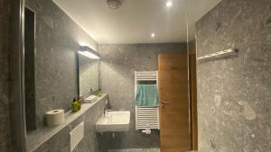 a bathroom with a sink and a mirror at Haus Stockibach in Sankt Anton am Arlberg