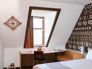 Ένα ή περισσότερα κρεβάτια σε δωμάτιο στο Ibis Bratislava Centrum