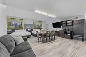 a living room with a couch and a dining room at Super 8 by Wyndham Texas City in Texas City