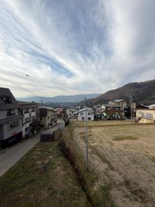 a street sign in the middle of a town at Nozawa Nest in Nozawa Onsen