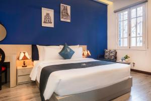 En eller flere senge i et værelse på LPM Apartment Pho Hue