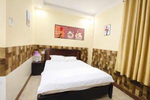 a bedroom with a bed in a room at Lucky 1 Hotel in Trà Vinh
