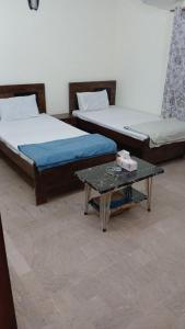 Postel nebo postele na pokoji v ubytování Family Inn Guest House