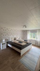 Postel nebo postele na pokoji v ubytování Hus Marie - schwedischer Waldhof in einsamer Lage