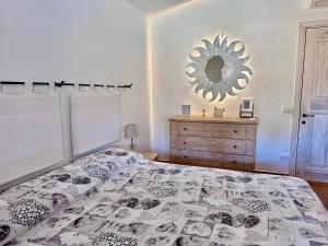 Giường trong phòng chung tại Villa Titimbaru