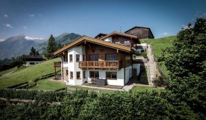 a large house on top of a hill at Chalet an der Piste in Kaprun