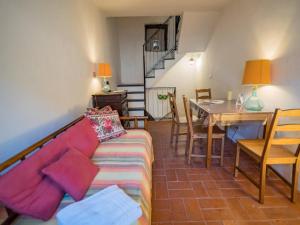 a living room with a couch and a table at Refilea Sea View Tower Villa in Vernazza