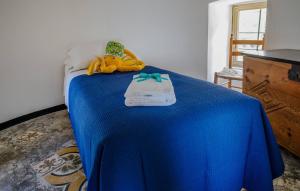 a blue bed with stuffed animals on top of it at Muin a Ventu Historical Tower in Vernazza