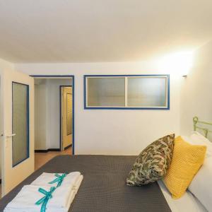 a bedroom with a bed and a window at Mainetta Sea View Apartment with AC in Vernazza