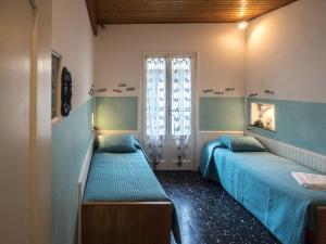 Postel nebo postele na pokoji v ubytování Recanissu Apartment with balcony & AC