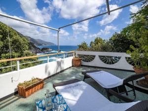 a view of the ocean from the balcony of a villa at Villa Tanca With AC, Terrace and Views in Monterosso al Mare