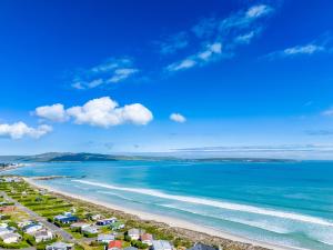 a view of a beach with houses and the ocean at The Pelican in Langebaan