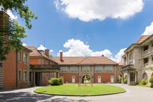 a large brick building with a park in front of it at Villa Morriss Residence - D'CONG Heritage in Shanghai
