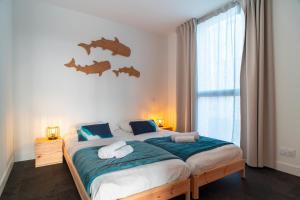 Postel nebo postele na pokoji v ubytování Le Chant des Vagues - A quelques min de Carnac