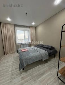 a bedroom with a bed and a window at Boroboye, Burabay, Kazakhstan in Borovoye