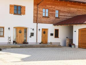 a group of doors on the side of a building at Eberlhof in Schechen