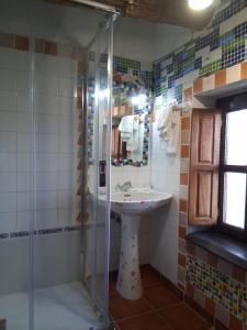 a bathroom with a sink and a shower at R2R - Ático con encanto Colindres - C08A01 in Colindres +23 photos