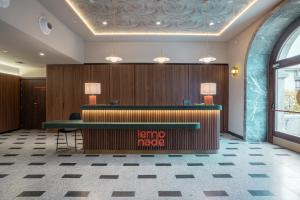 a lobby of a hotel with a reception desk at Lemonade Stays Santiago de Compostela in Santiago de Compostela +37 photos