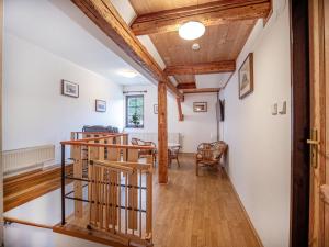 a hallway with white walls and wooden beams at Nová Hájovna in Říčky