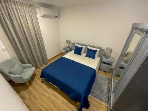 En eller flere senge i et værelse på Casa do Barbosa