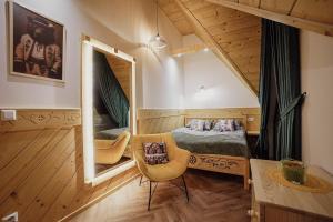a bedroom with a bed and a large mirror at Krzeptówki House in Zakopane