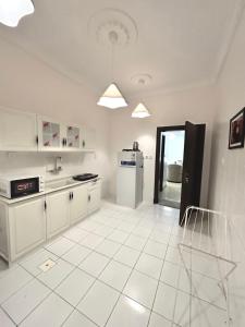 Kuchyň nebo kuchyňský kout v ubytování نسمة كيان للشقق المخدومة