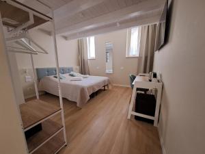 Postel nebo postele na pokoji v ubytování Photomusic Boutique Rooms