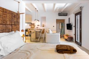 a bedroom with a bed and a living room at stema suite 1 in Tripiti