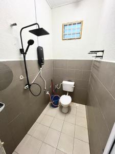 Koupelna v ubytování Home Stay Tok Ayah