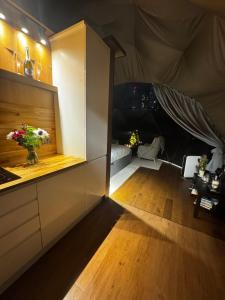 a room with a tent with a table and flowers at Princess Milena in London
