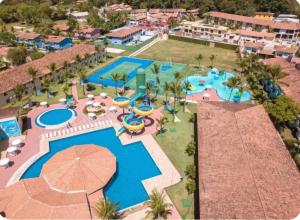 an aerial view of a pool at a resort at Portobello in Porto Seguro +2 photos