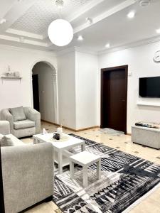 TV a/nebo společenská místnost v ubytování نسمة كيان للشقق المخدومة