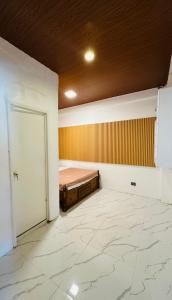 Giường trong phòng chung tại LALEAH Transient House +2 ảnh