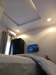 Ένα ή περισσότερα κρεβάτια σε δωμάτιο στο Heirloom Luxury Hotel and Apartments