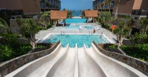 a water slide at a resort at Mandala Mui Ne - Beach & Pool Suites in Mui Ne