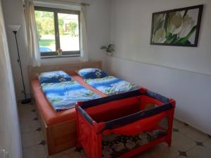 En eller flere senge i et værelse på Ubytováni U rybníčku