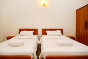 Postel nebo postele na pokoji v ubytování Gangabagh by Divine Trails