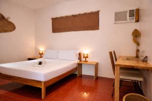 Giường trong phòng chung tại Masayana