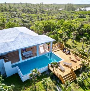 an aerial view of a villa with a swimming pool at 8 Bedroom Ocean Front in Eleuthera Double Bay with pool in Savannah Sound