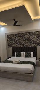 En eller flere senge i et værelse på Hotel La Serene