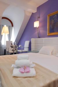 Postel nebo postele na pokoji v ubytování Hotel Phoenix