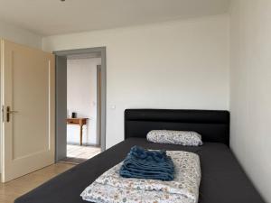 a bedroom with two beds and a door to a room at Haus Raschke in Schongau