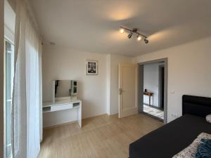 a living room with a bed and a television at Haus Raschke in Schongau +8 photos