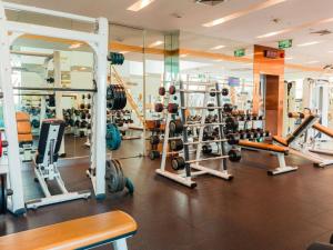 a gym with a lot of weights and machines at VIE Hotel Bangkok - MGallery Collection in Bangkok +98 photos