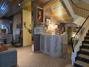 a room with a store with a staircase and a stair case at Hotel Marittimo in Rimini