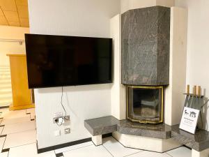 TV a/nebo společenská místnost v ubytování Ferienhaus am Strand + 32 fotografií