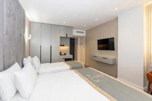 En eller flere senge i et værelse på Tumar Hotel + 62 billeder