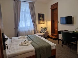 Voodi või voodid majutusasutuse Apartmány Aurelius toas