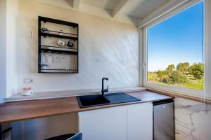 Kuchyň nebo kuchyňský kout v ubytování Suite La Perla Nera