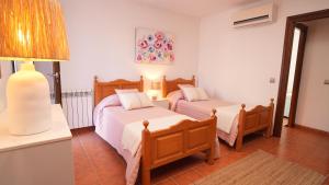 Postel nebo postele na pokoji v ubytování Villa Margarita + 5 fotografií